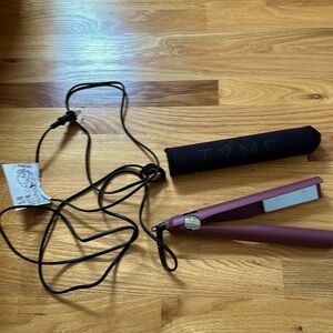 Tyme curler with storage sleeve